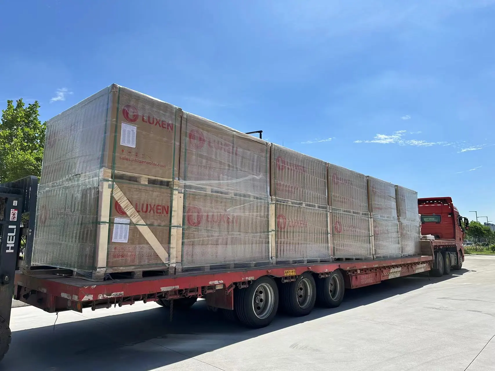 Luxen solar panels securely packed in protective boxes, wrapped for safe transportation.