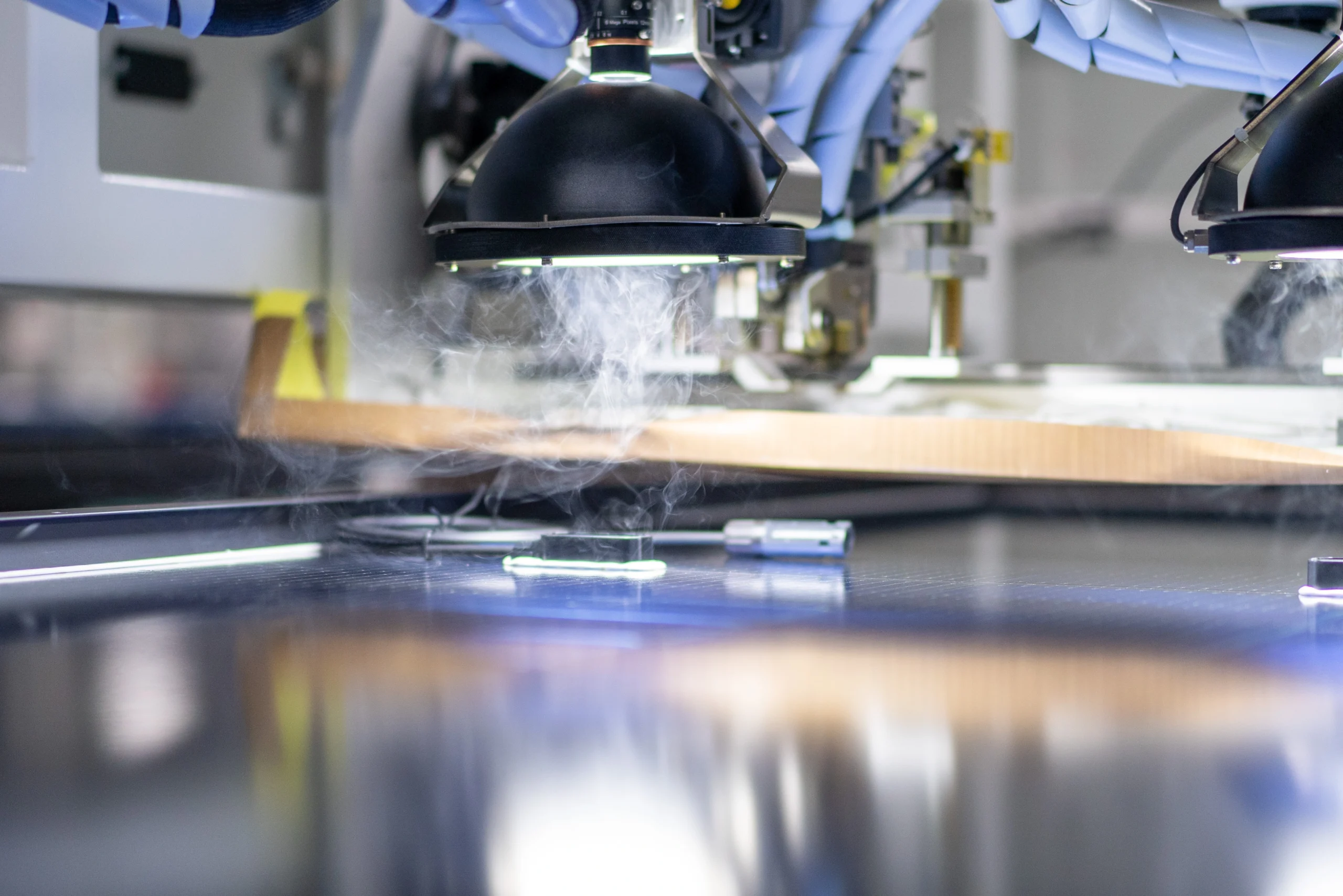 Advanced automated manufacturing process with robotics and smart devices for solar panel production